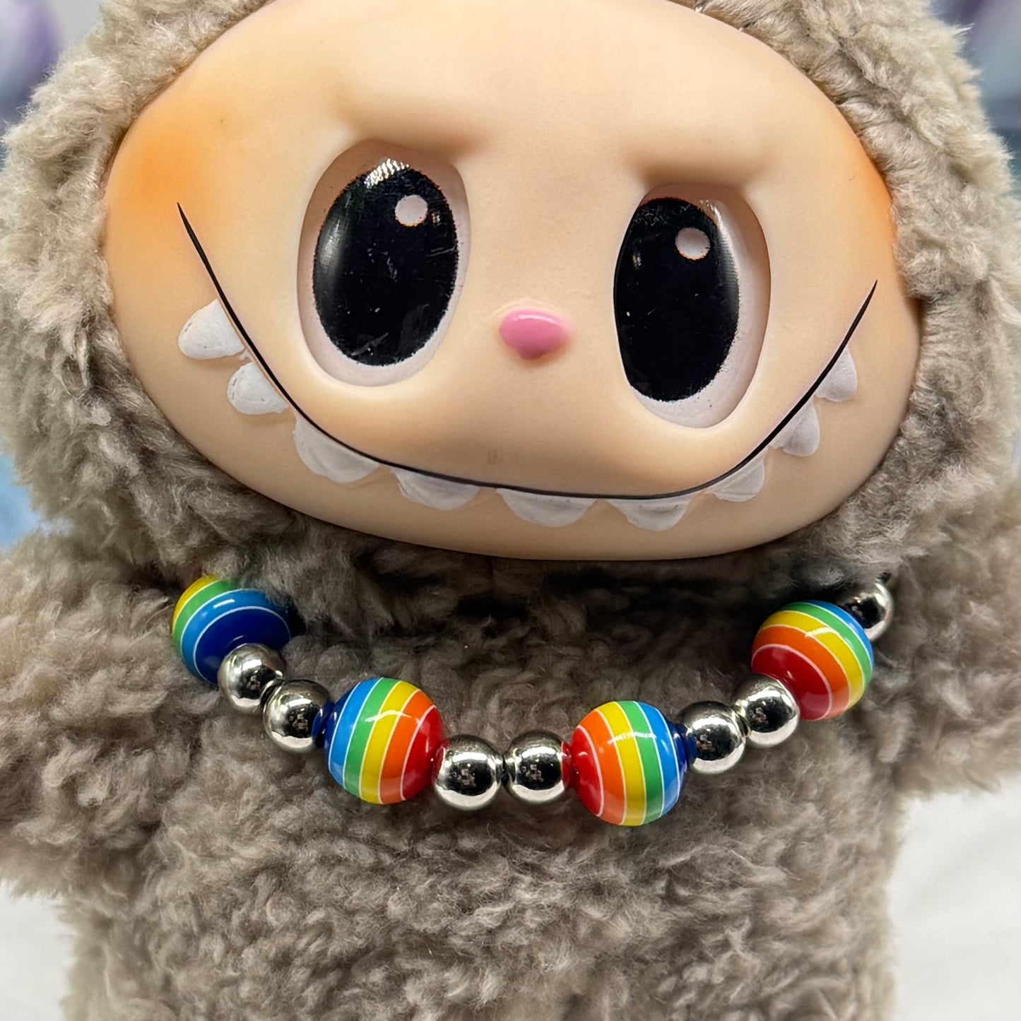 ✨Handmade Jewelry Designed to fit popular 17 to 20 cm (6 to 7 inch) Plushie Labubu Monster Dolls: add a stylish touch to your favorite plushie! ✨

Rainbow Striped Ball and Silver Beaded Necklace