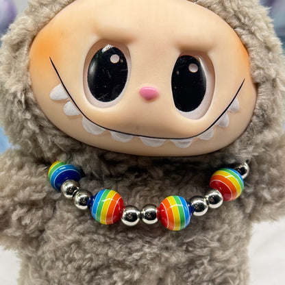 ✨Handmade Jewelry Designed to fit popular 17 to 20 cm (6 to 7 inch) Plushie Labubu Monster Dolls: add a stylish touch to your favorite plushie! ✨

Rainbow Striped Ball and Silver Beaded Necklace