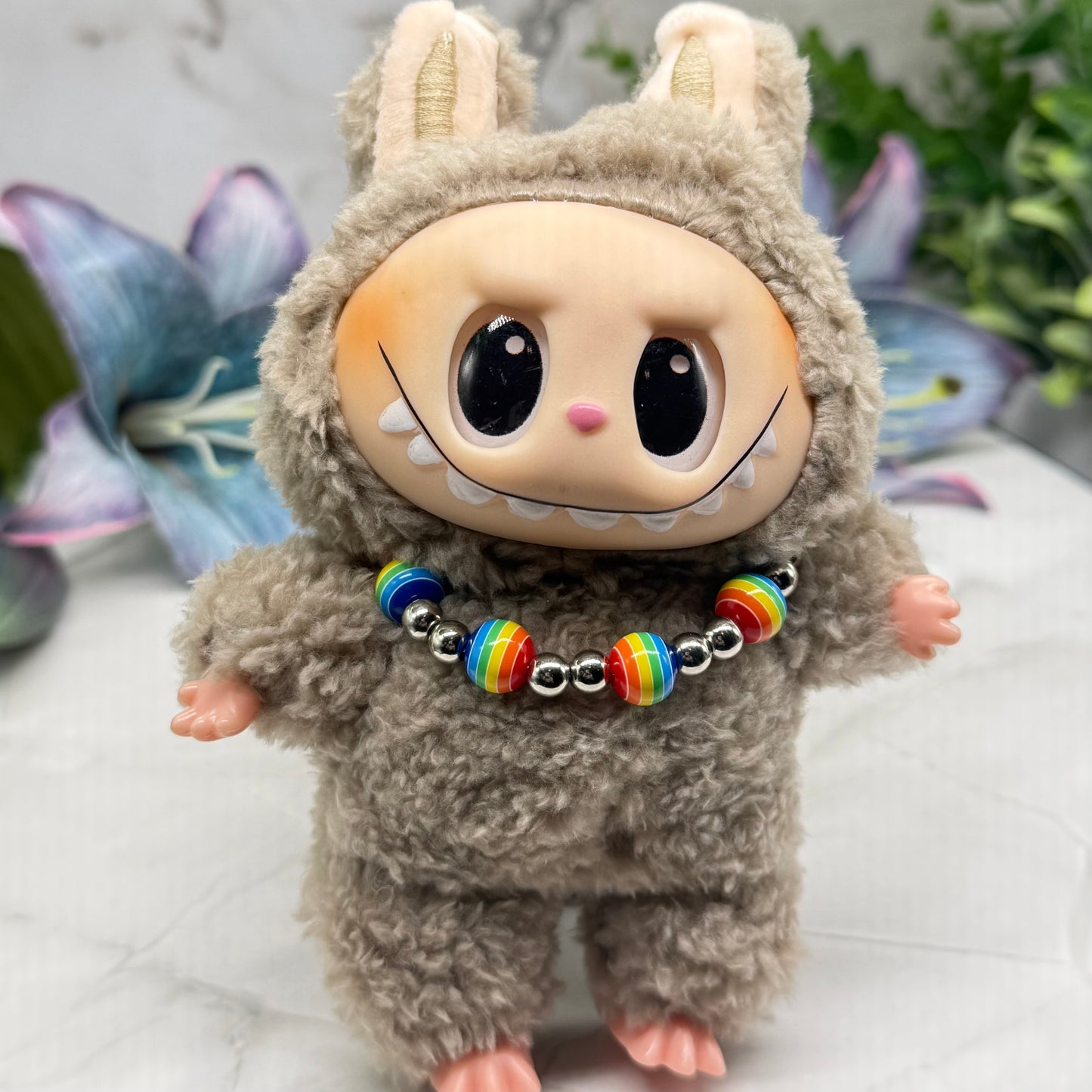 ✨Handmade Jewelry Designed to fit popular 17 to 20 cm (6 to 7 inch) Plushie Labubu Monster Dolls: add a stylish touch to your favorite plushie! ✨

Rainbow Striped Ball and Silver Beaded Necklace