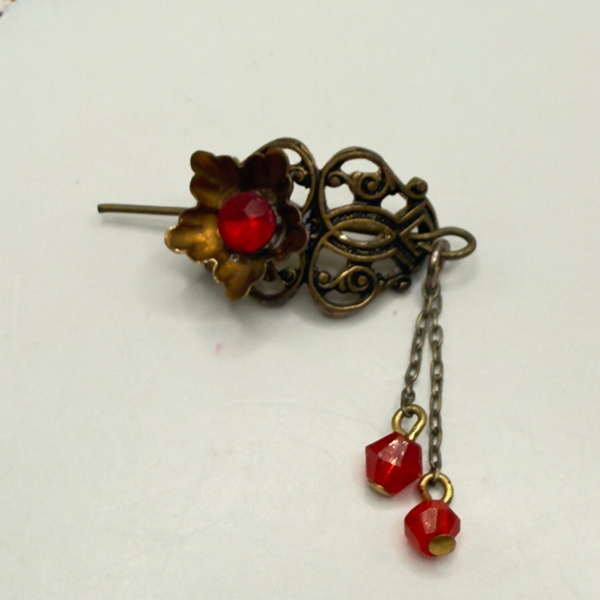Handmade Doll Accessories Designed to Fit popular 16 inch Fashion Dolls: add a stylish touch to your favorite doll! 
Red Rhinestone Crystal Dangles Bronze Brass Tone Metal Filigree Flower Design Doll Hair Stick
