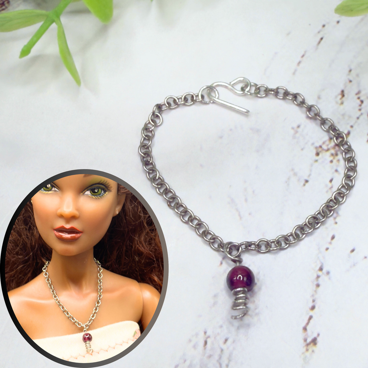 Red Drop Silver Spiral Pendant Doll Necklace. Necklace chain measures 3 7/8 inches long. Necklace shown on 16” Spellbound Valentina doll