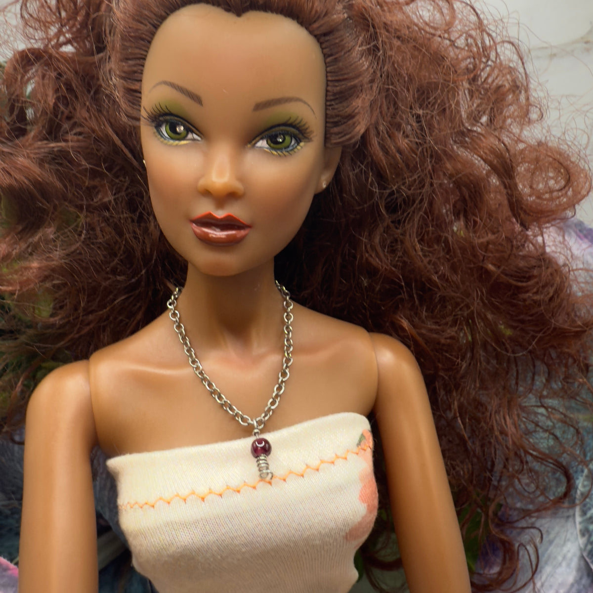 Red Drop Silver Spiral Pendant Doll Necklace. Necklace chain measures 3 7/8 inches long. Necklace shown on 16” Spellbound Valentina doll