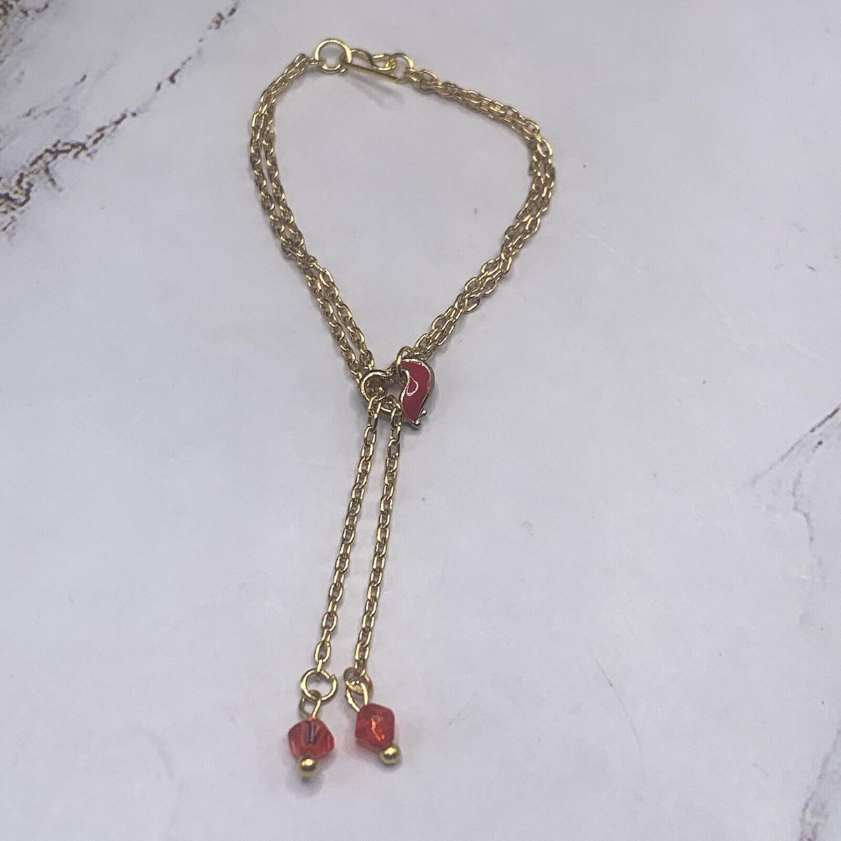 ✨Handmade Doll Jewelry Designed to Fit popular 16 Inch Fashion Dolls: add a stylish touch to your favorite doll!✨

Red Heart Slide Bolo Style Gold tone Chain with Red Crystal end accents Doll Necklace. Necklace measures approximately 4 - 5 inches long with slider style.