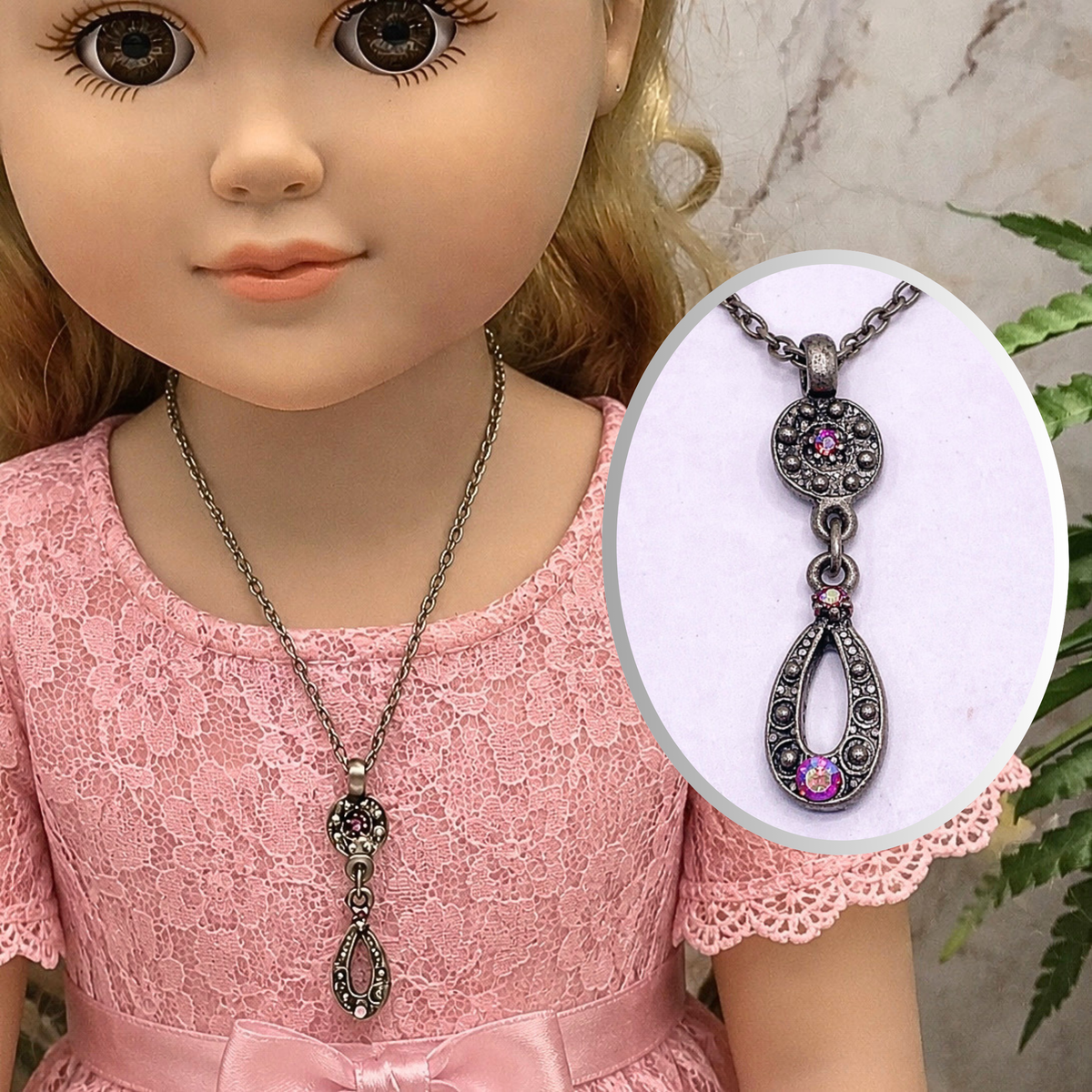 Add a touch of elegance to your favorite doll's outfit with this Red AB Rhinestone Dangle Pendant Gun Metal silver Doll Necklace. The necklace measures 8.25 inches long. Necklace shown on 18" My Life As doll