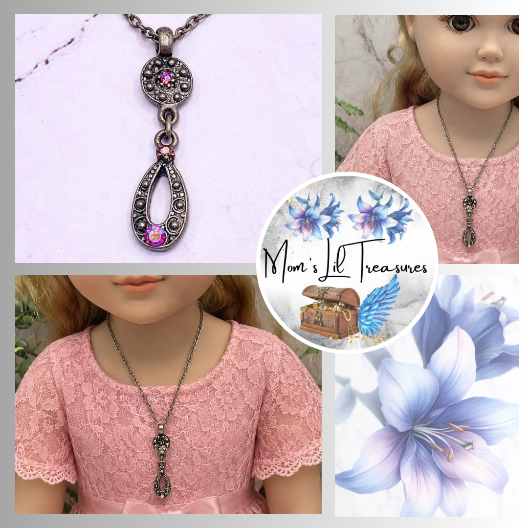Add a touch of elegance to your favorite doll's outfit with this Red AB Rhinestone Dangle Pendant Gun Metal silver Doll Necklace. The necklace measures 8.25 inches long. Necklace shown on 18" My Life As doll