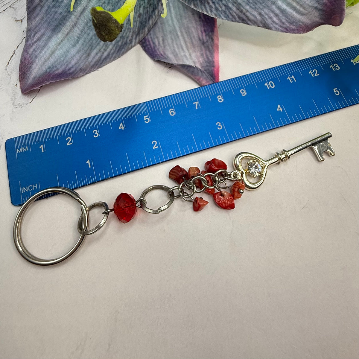 Silver Heart Top Key Charm Red Glass Stone Dangles Key Chain. Total length of key chain is 4-3/4 inches long. Ring is 7/8” diameter. Dangle section is 3-3/4 inches long.
Add this Key Chain for a touch of style!