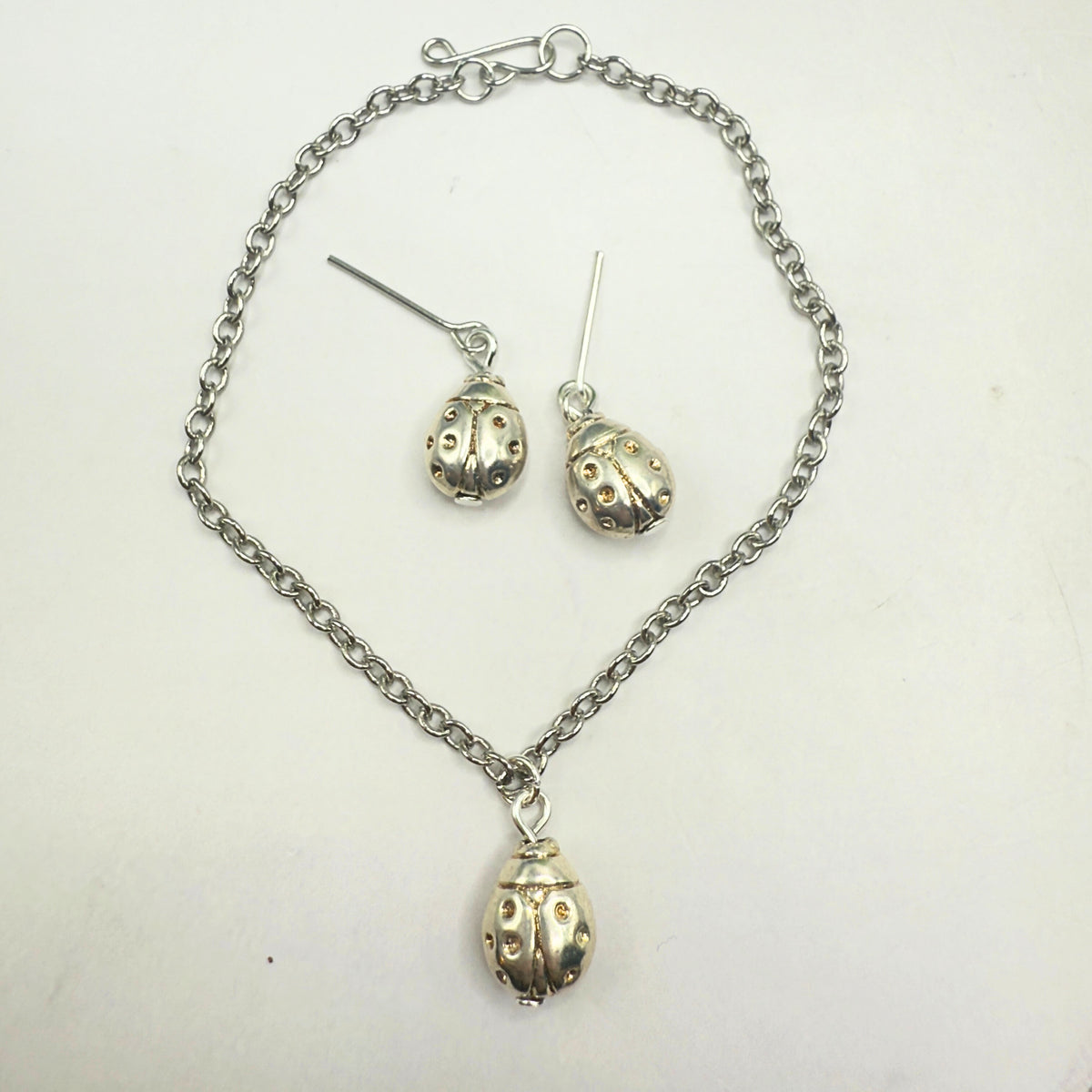 Silver Lady Bug Charm Doll Necklace & Earrings Set • necklace measures 7.25 inches long • necklace and earrings shown on 18" fashion doll