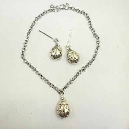 Silver Lady Bug Charm Doll Necklace & Earrings Set • necklace measures 7.25 inches long • necklace and earrings shown on 18" fashion doll