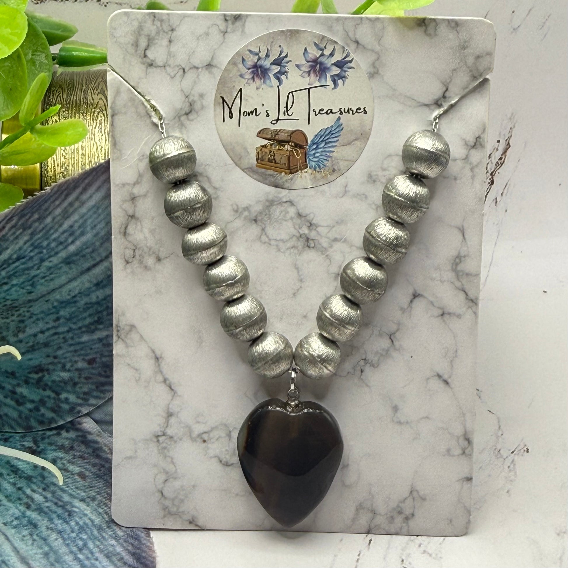 ✨Handmade Jewelry Designed to fit popular 17 to 20 cm (6 to 7 inch) Plushie Labubu Monster Dolls: add a stylish touch to your favorite plushie! ✨

Silver Metal Beaded Brown Glass Heart Charm Necklace
