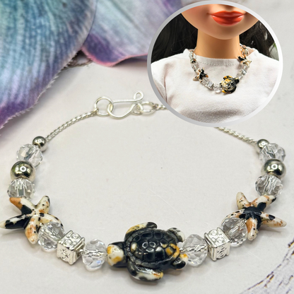 ✨Handmade Doll Jewelry Designed to Fit popular 18 Inch Fashion Dolls: add a little “Summer Fun ☀️ Beachy Style 🏝️” to your favorite doll!✨

Black Yellow Starfish Sea Turtle Charm Clear Crystal Beaded Doll Necklace