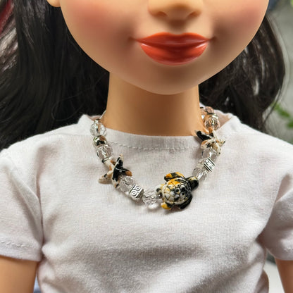 ✨Handmade Doll Jewelry Designed to Fit popular 18 Inch Fashion Dolls: add a little “Summer Fun ☀️ Beachy Style 🏝️” to your favorite doll!✨

Black Yellow Starfish Sea Turtle Charm Clear Crystal Beaded Doll Necklace