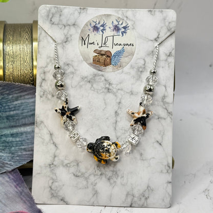 ✨Handmade Doll Jewelry Designed to Fit popular 18 Inch Fashion Dolls: add a little “Summer Fun ☀️ Beachy Style 🏝️” to your favorite doll!✨

Black Yellow Starfish Sea Turtle Charm Clear Crystal Beaded Doll Necklace