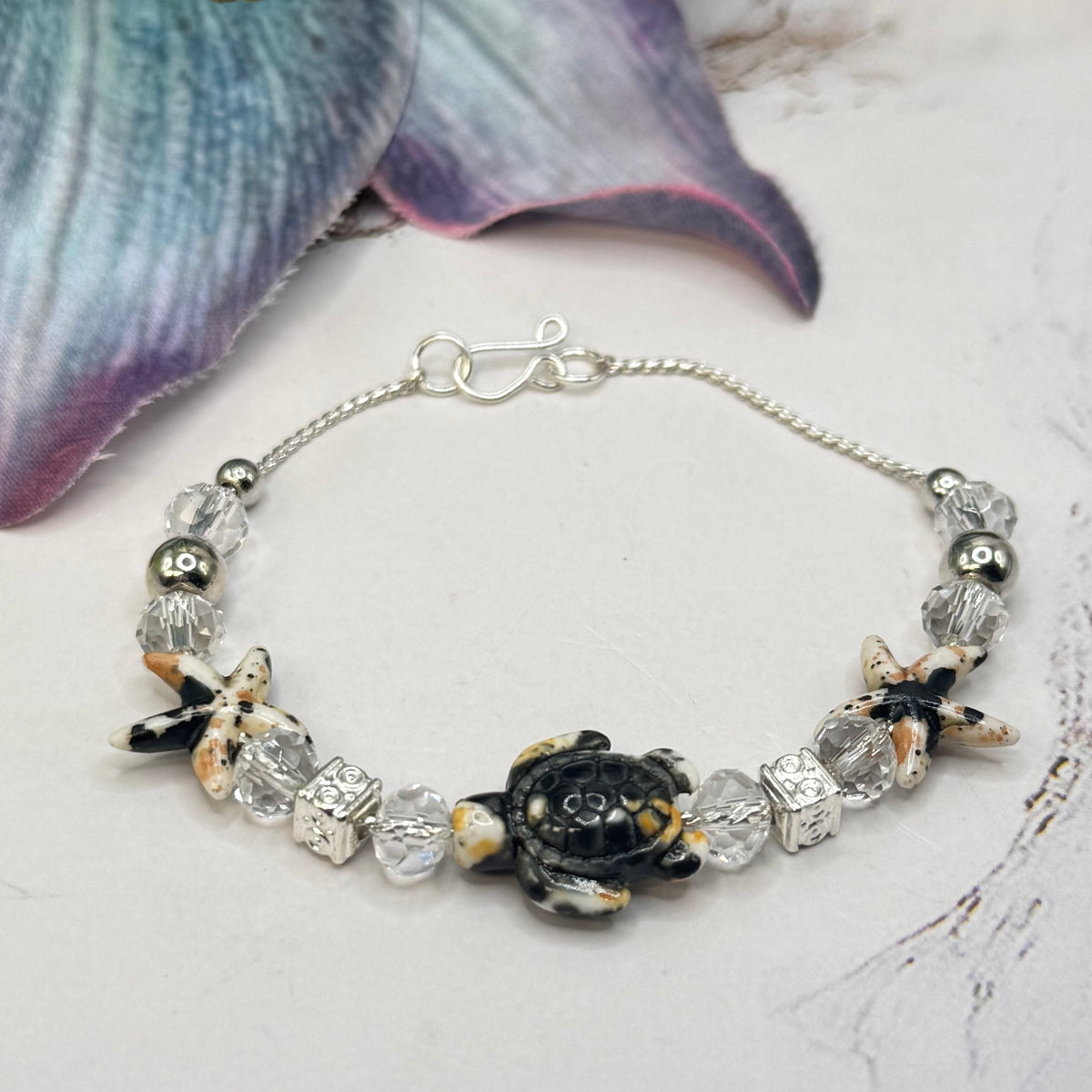✨Handmade Doll Jewelry Designed to Fit popular 18 Inch Fashion Dolls: add a little “Summer Fun ☀️ Beachy Style 🏝️” to your favorite doll!✨

Black Yellow Starfish Sea Turtle Charm Clear Crystal Beaded Doll Necklace