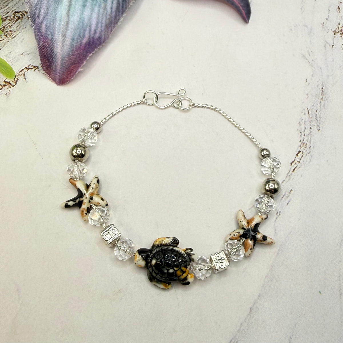 ✨Handmade Doll Jewelry Designed to Fit popular 18 Inch Fashion Dolls: add a little “Summer Fun ☀️ Beachy Style 🏝️” to your favorite doll!✨

Black Yellow Starfish Sea Turtle Charm Clear Crystal Beaded Doll Necklace