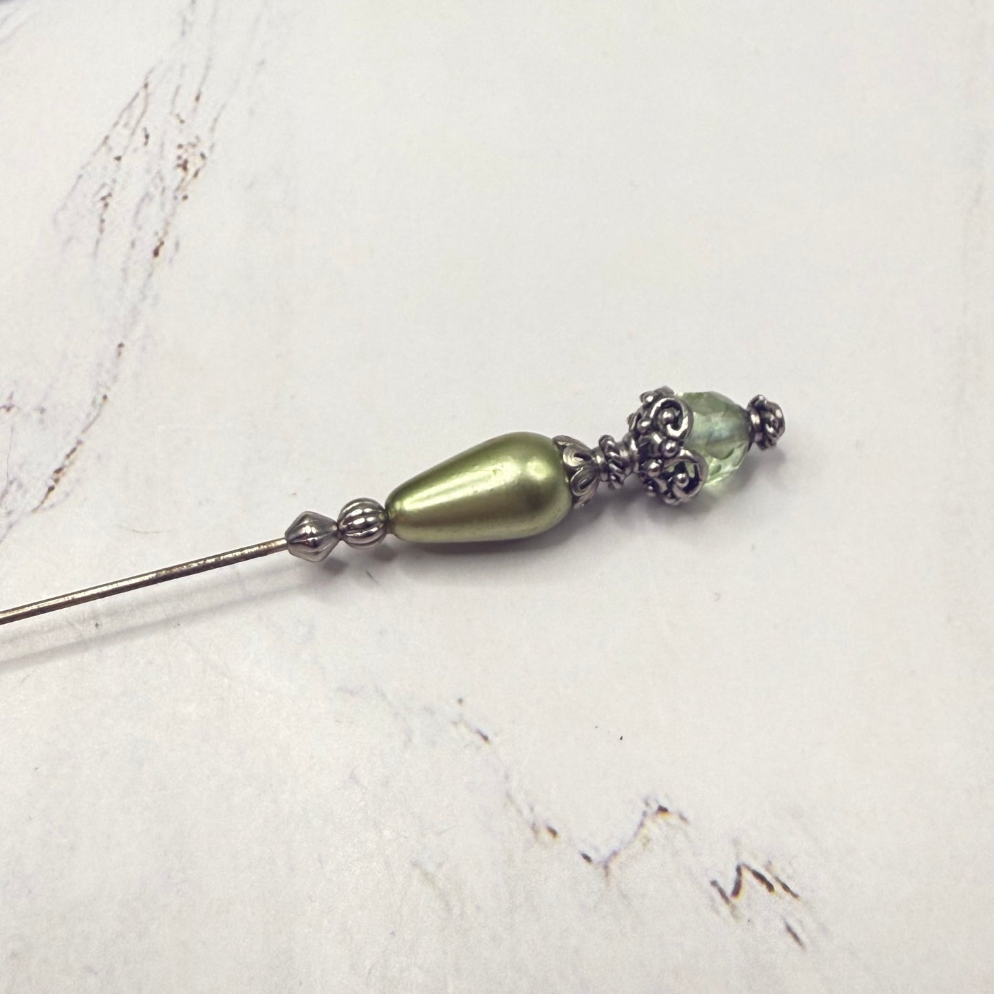 ✨ Handmade Vintage-Inspired Hatpin | Stick Pin | Hat Accessory | Sweater & Hijab Pin | Decorative Jewelry Gift for Her ✨

Teardrop Light Green Faux Pearl & Faceted Glass Crystal Silver Filigree Hatpin - 6 Inch