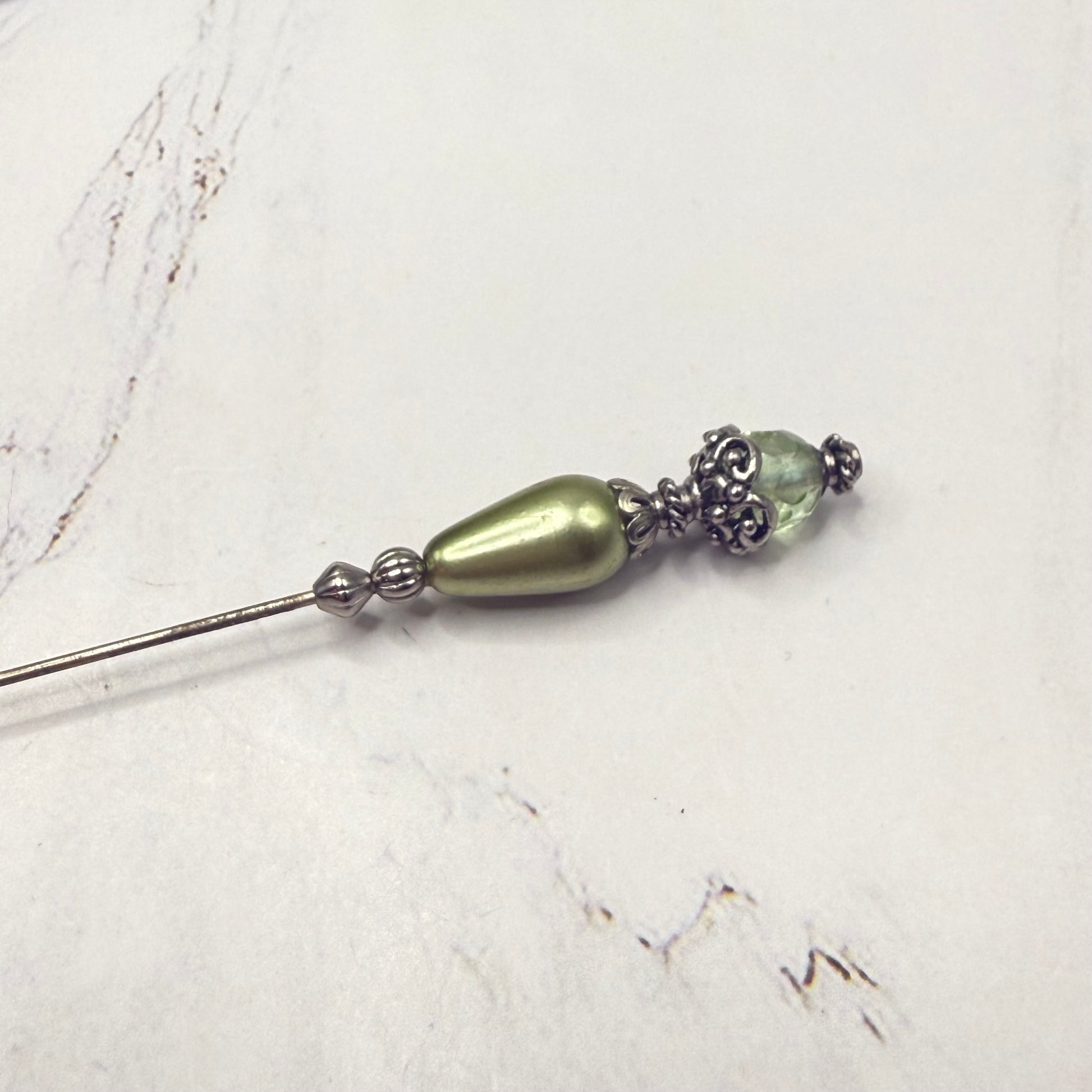 ✨ Handmade Vintage-Inspired Hatpin | Stick Pin | Hat Accessory | Sweater & Hijab Pin | Decorative Jewelry Gift for Her ✨

Teardrop Light Green Faux Pearl & Faceted Glass Crystal Silver Filigree Hatpin - 6 Inch