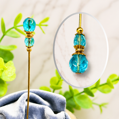 ✨ Handmade Vintage-Inspired Hatpin | Stick Pin | Hat Accessory | Shawl - Scarf  - Hijab Pin | Decorative Jewelry Gift for Her ✨

Translucent Aqua-Blue Facted Glass Crystal and Gold Tone Accents Hatpin - 6 inch