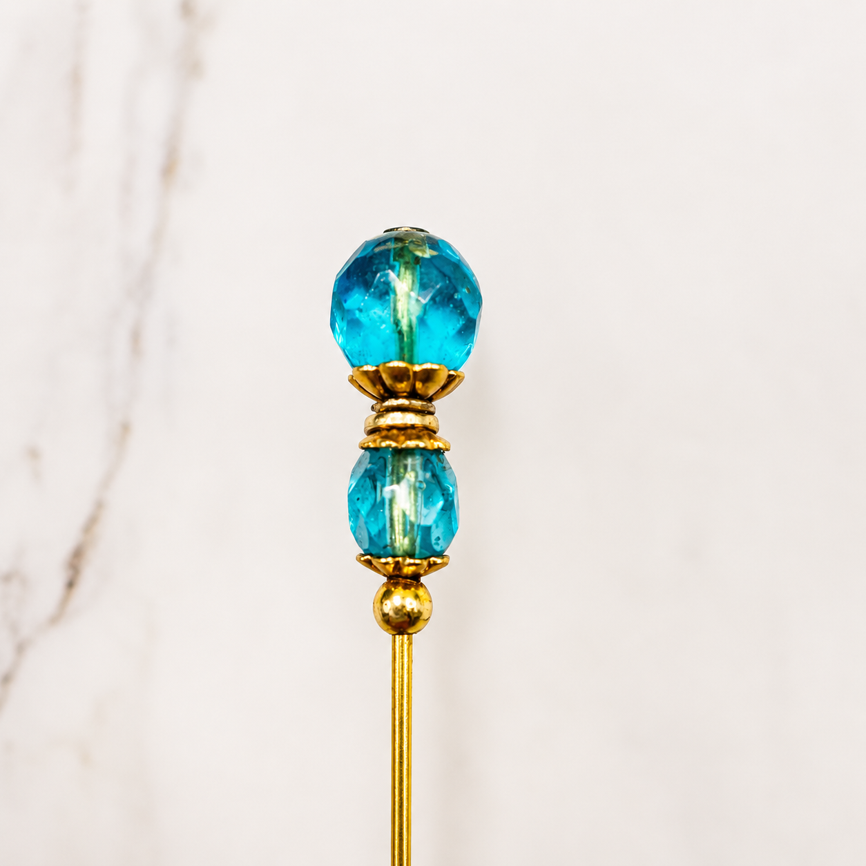 ✨ Handmade Vintage-Inspired Hatpin | Stick Pin | Hat Accessory | Shawl - Scarf  - Hijab Pin | Decorative Jewelry Gift for Her ✨

Translucent Aqua-Blue Facted Glass Crystal and Gold Tone Accents Hatpin - 6 inch