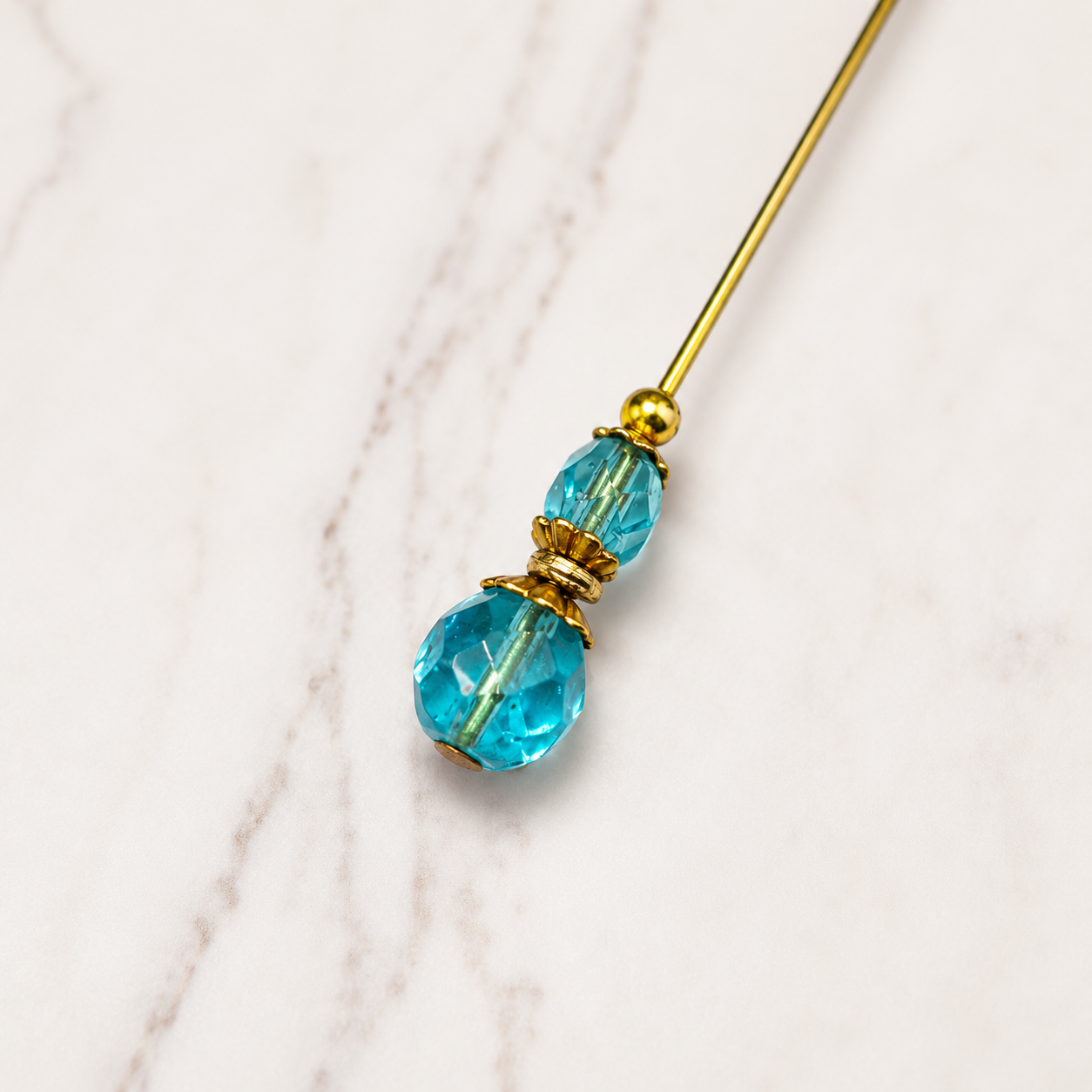 ✨ Handmade Vintage-Inspired Hatpin | Stick Pin | Hat Accessory | Shawl - Scarf  - Hijab Pin | Decorative Jewelry Gift for Her ✨

Translucent Aqua-Blue Facted Glass Crystal and Gold Tone Accents Hatpin - 6 inch