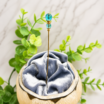 ✨ Handmade Vintage-Inspired Hatpin | Stick Pin | Hat Accessory | Shawl - Scarf  - Hijab Pin | Decorative Jewelry Gift for Her ✨

Translucent Aqua-Blue Facted Glass Crystal and Gold Tone Accents Hatpin - 6 inch