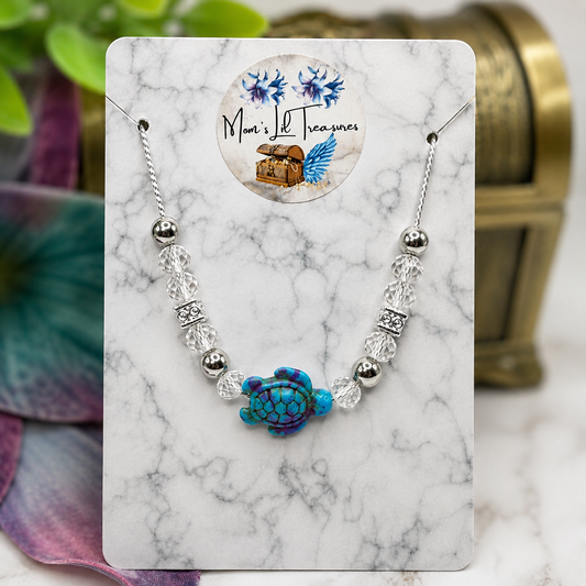 ✨Handmade Doll Jewelry Designed to Fit popular 18 Inch Fashion Dolls: add a little “Summer Fun ☀️ Beachy Style 🏝️” to your favorite doll!✨

Turquoise Purple Turtle Charm Clear Crystal and Silver Beaded Doll Necklace