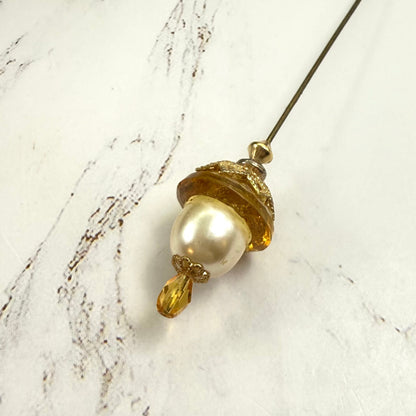 ✨ Handmade Vintage-Inspired Hatpin | Stick Pin | Hat Accessory | Sweater & Hijab Pin | Decorative Jewelry Gift for Her ✨

Yellow Amber Glass Cupped Faux Pearl Gold Tone Filigree Accent Hatpin - 7 Inch