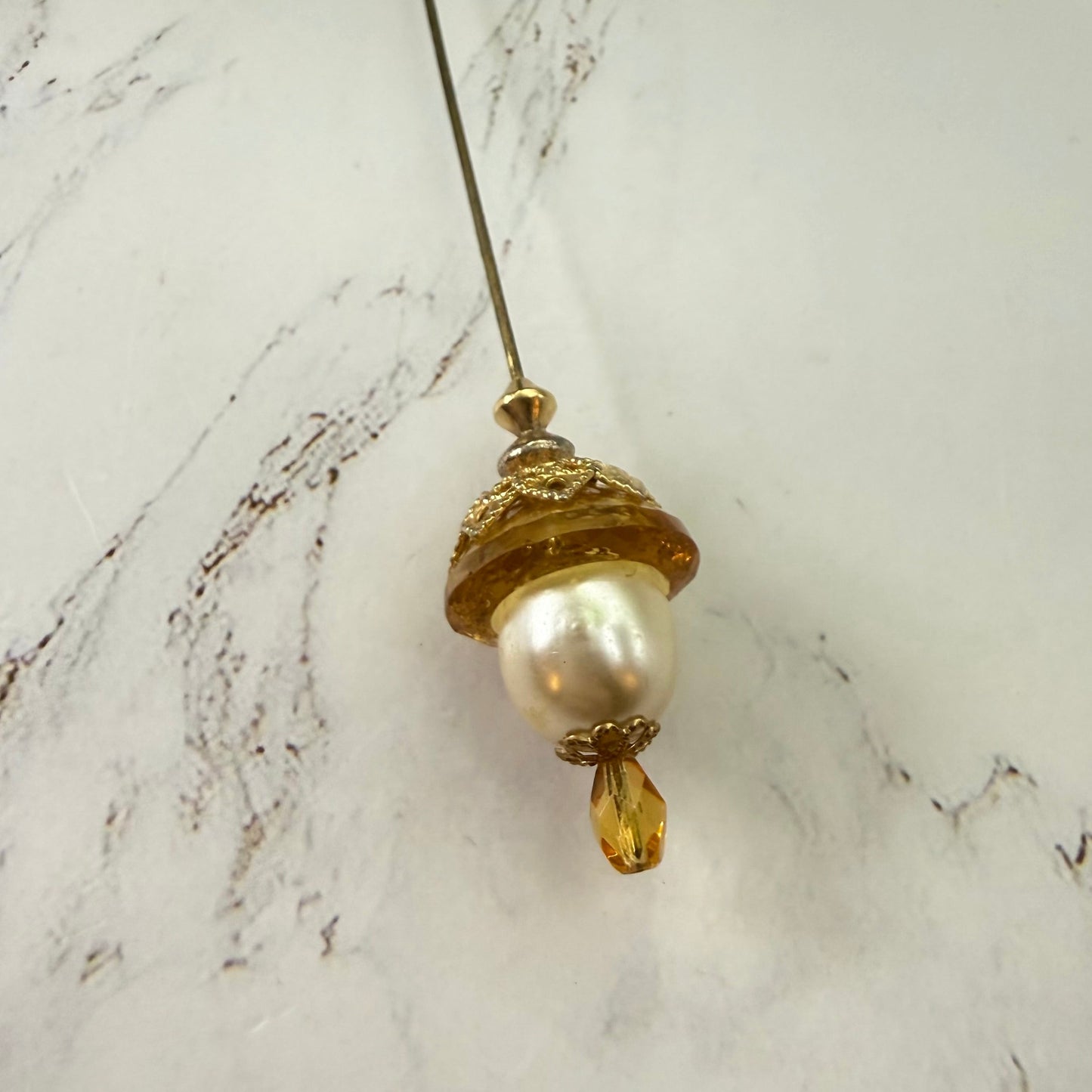 ✨ Handmade Vintage-Inspired Hatpin | Stick Pin | Hat Accessory | Sweater & Hijab Pin | Decorative Jewelry Gift for Her ✨

Yellow Amber Glass Cupped Faux Pearl Gold Tone Filigree Accent Hatpin - 7 Inch