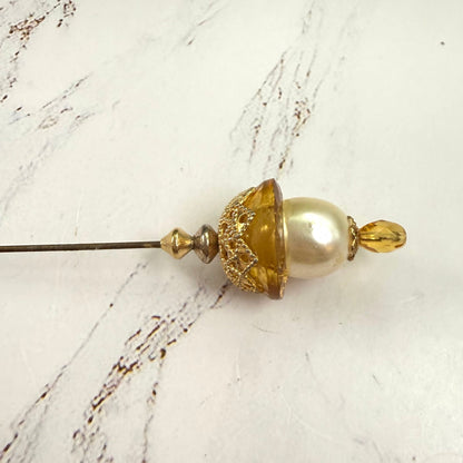 ✨ Handmade Vintage-Inspired Hatpin | Stick Pin | Hat Accessory | Sweater & Hijab Pin | Decorative Jewelry Gift for Her ✨

Yellow Amber Glass Cupped Faux Pearl Gold Tone Filigree Accent Hatpin - 7 Inch
