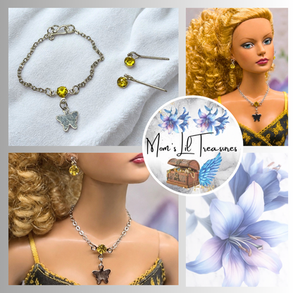 Yellow Rhinestone Silver Butterfly Charm Doll Necklace & Earrings Set • Necklace measures 3 3/4 inches long • Necklace and earrings shown on 16” Tonner - Sydney Chase “Envy” doll