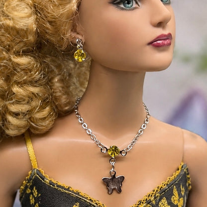 Yellow Rhinestone Silver Butterfly Charm Doll Necklace & Earrings Set • Necklace measures 3 3/4 inches long • Necklace and earrings shown on 16” Tonner - Sydney Chase “Envy” doll