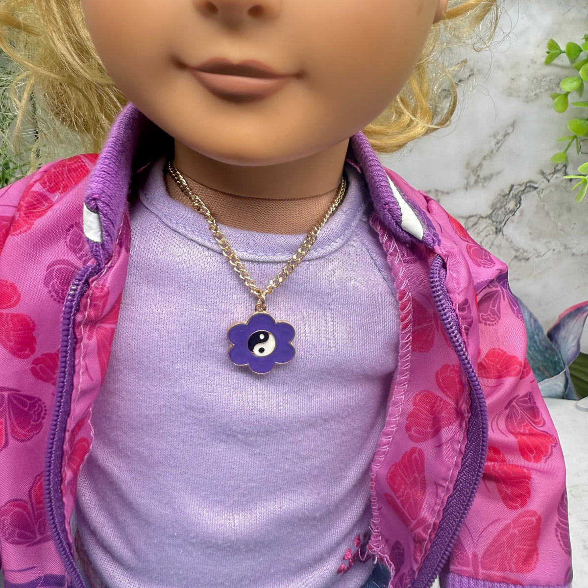 Yin-Yang Purple Flower Charm Gold Chain Doll Necklace. Necklace measures 7 inches long. Necklace shown on 18" Our Generation doll.